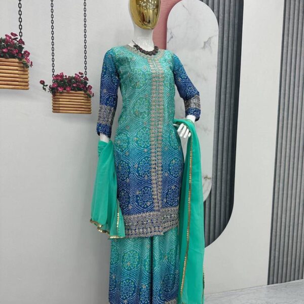 Chinon fabric sharara suit with embroidered and sequined detailing.